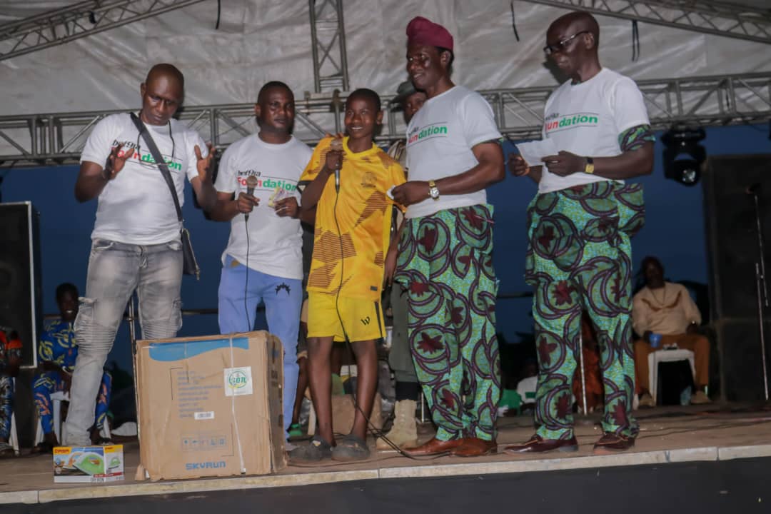 Community members receiving household equipment during Ago Iwoye community awareness